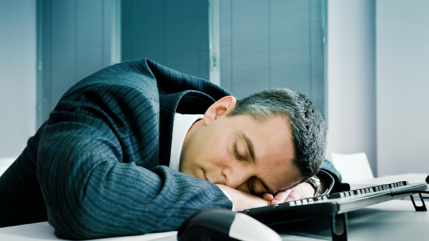 Businessman sleeping at desk